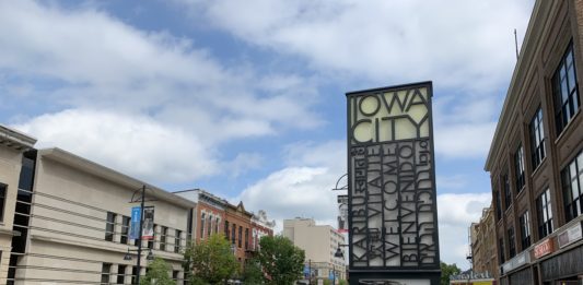 An image of the Iowa City sign on Washington Street in downtown Iowa City.