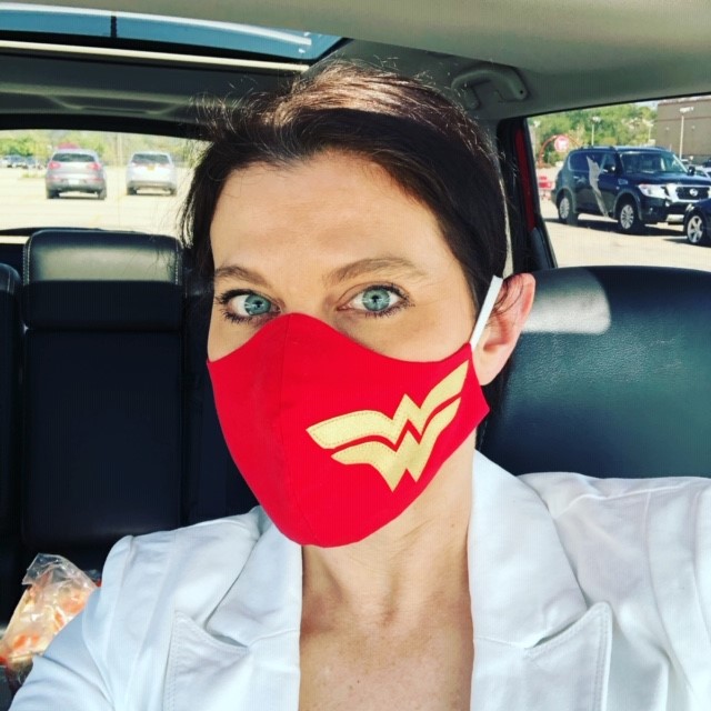 An image of a woman wearing a mask