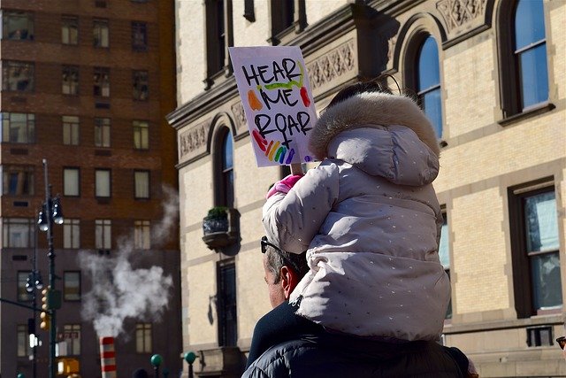 An image of child and parenting protesting. 