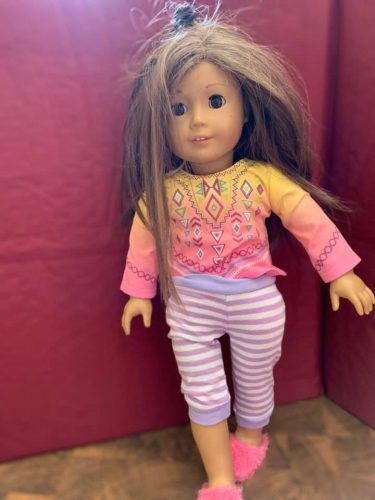 caucasian doll with messy brown hair