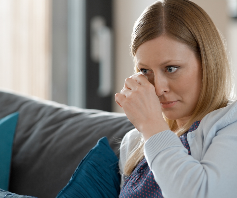 An image of a woman crying watching Bluey