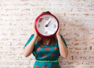 An image of a woman with a clock showing back to school morning routine